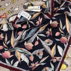 This is an Eton floral print silk pocket square